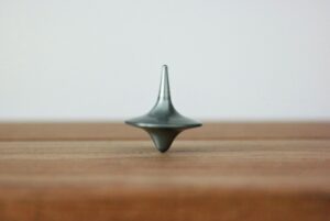 a spinning top denoting here and now